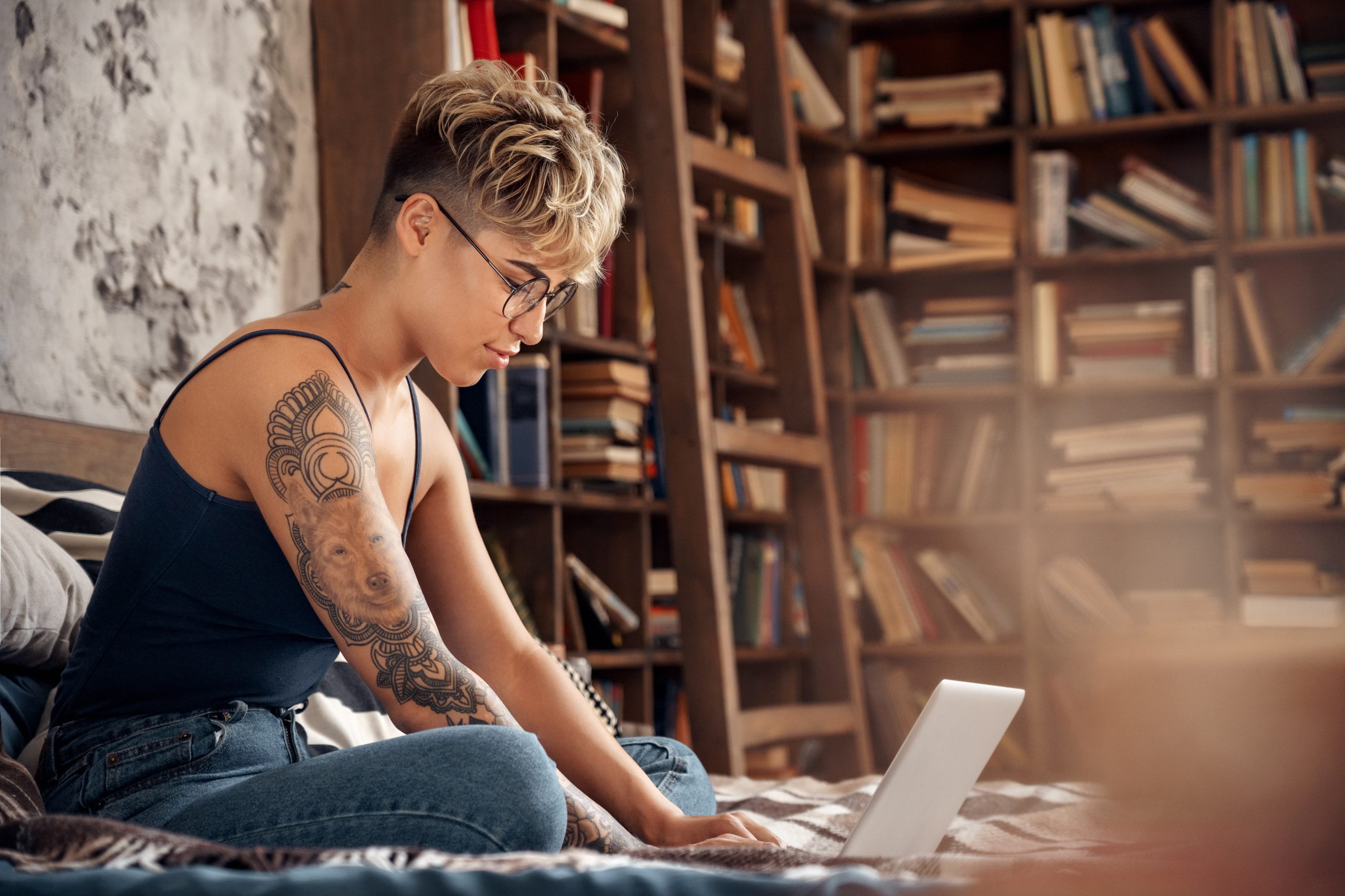 Decorative photograph of a student working on a laptop.