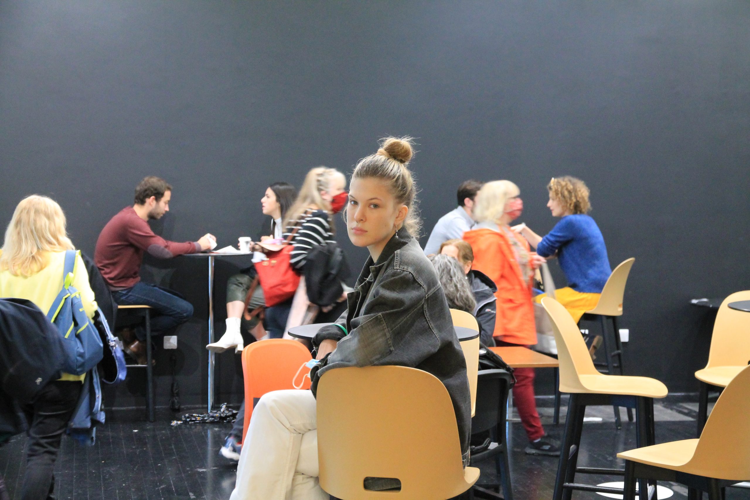 Decorative image of a student sitting alone at a table.