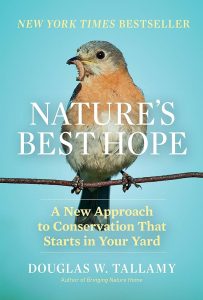 The cover of Douglas Tallamy's book Nature's Best Hope, a photo of a perched bird with a worm in its mouth with the book title overlayed.