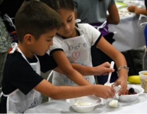 Two children cooking together