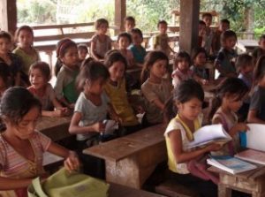 Children studying in an open air classroom.