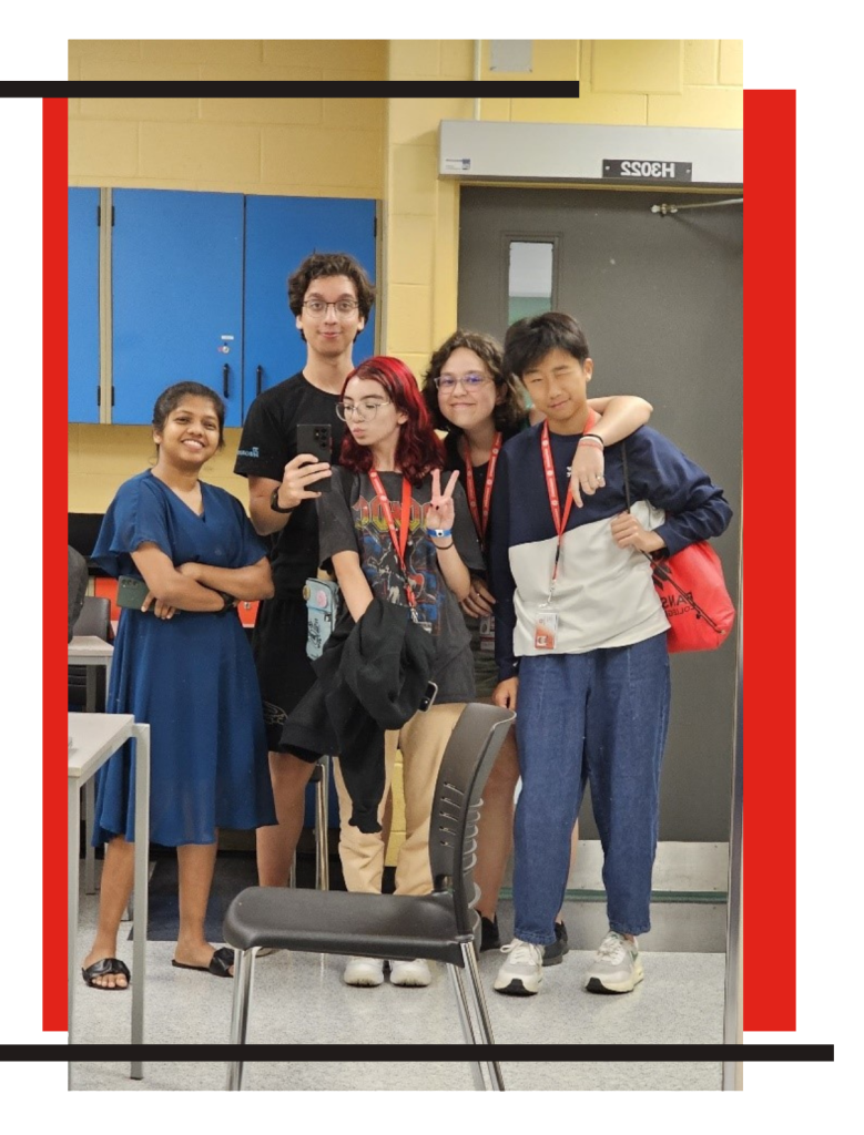 A group of students in the Youth Summer Program smiling and posing for a photo