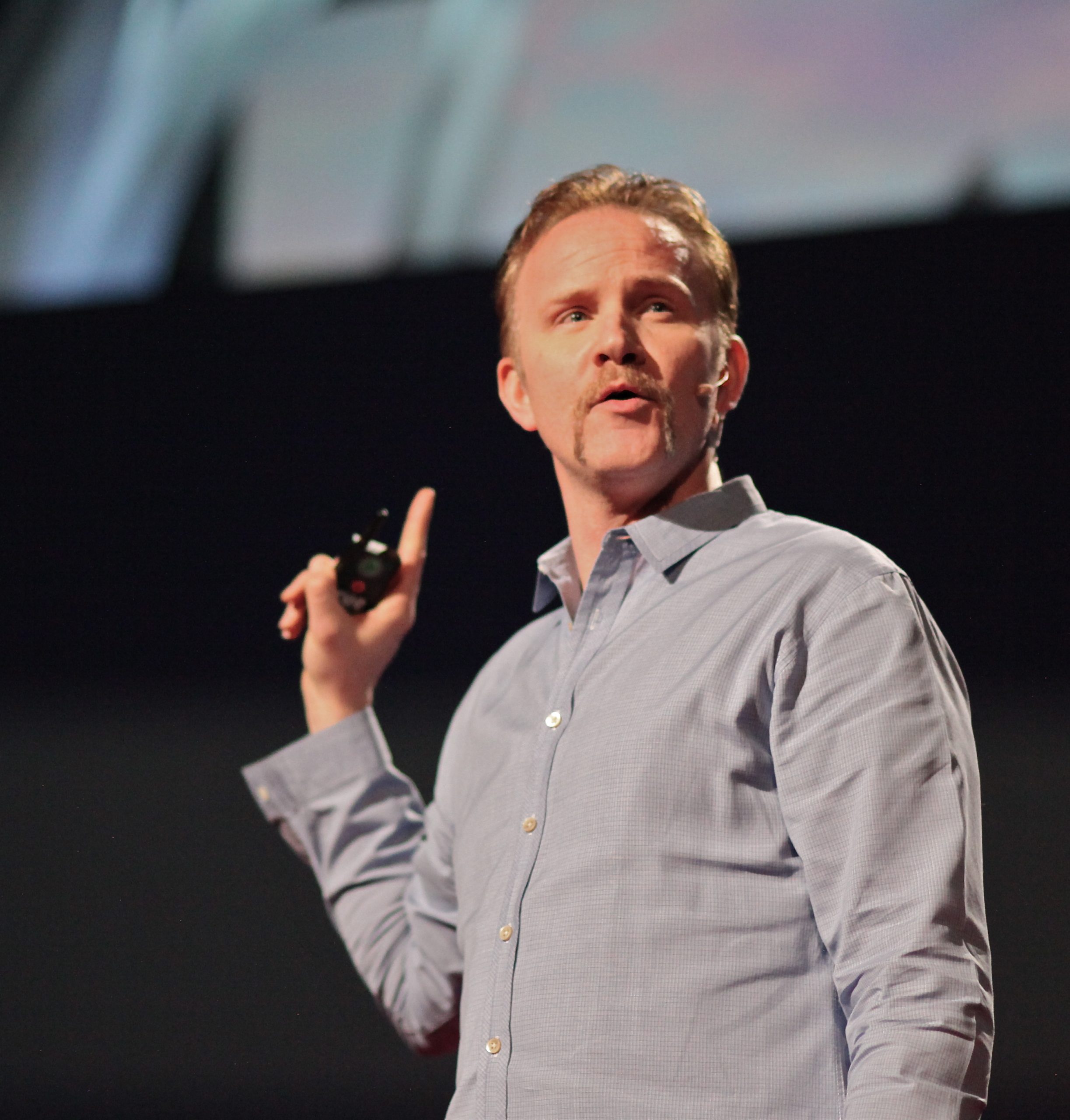 Morgan Spurlock speaking at an event.