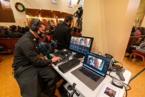 Image of audio-visual equipment set up at a wake to stream funeral proceedings for audiences to watch online.