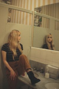 Girl looking in mirror