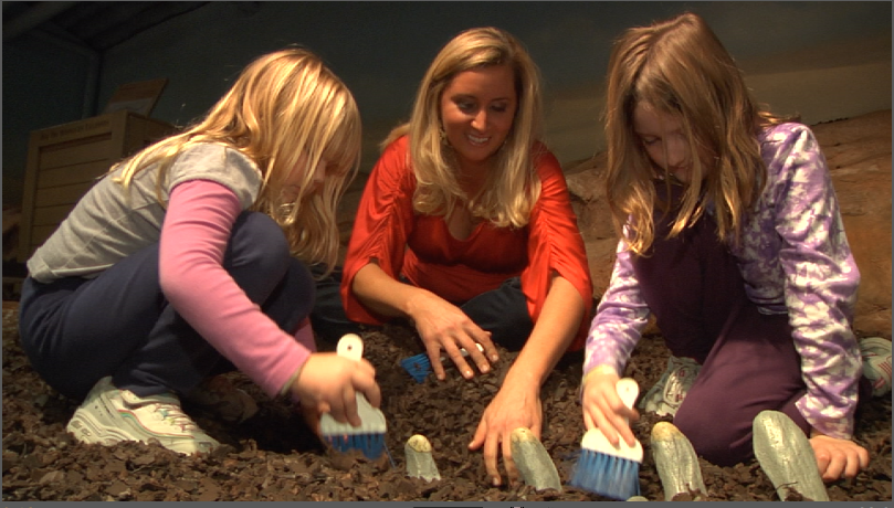 Image of children digging for fossils at a museum.