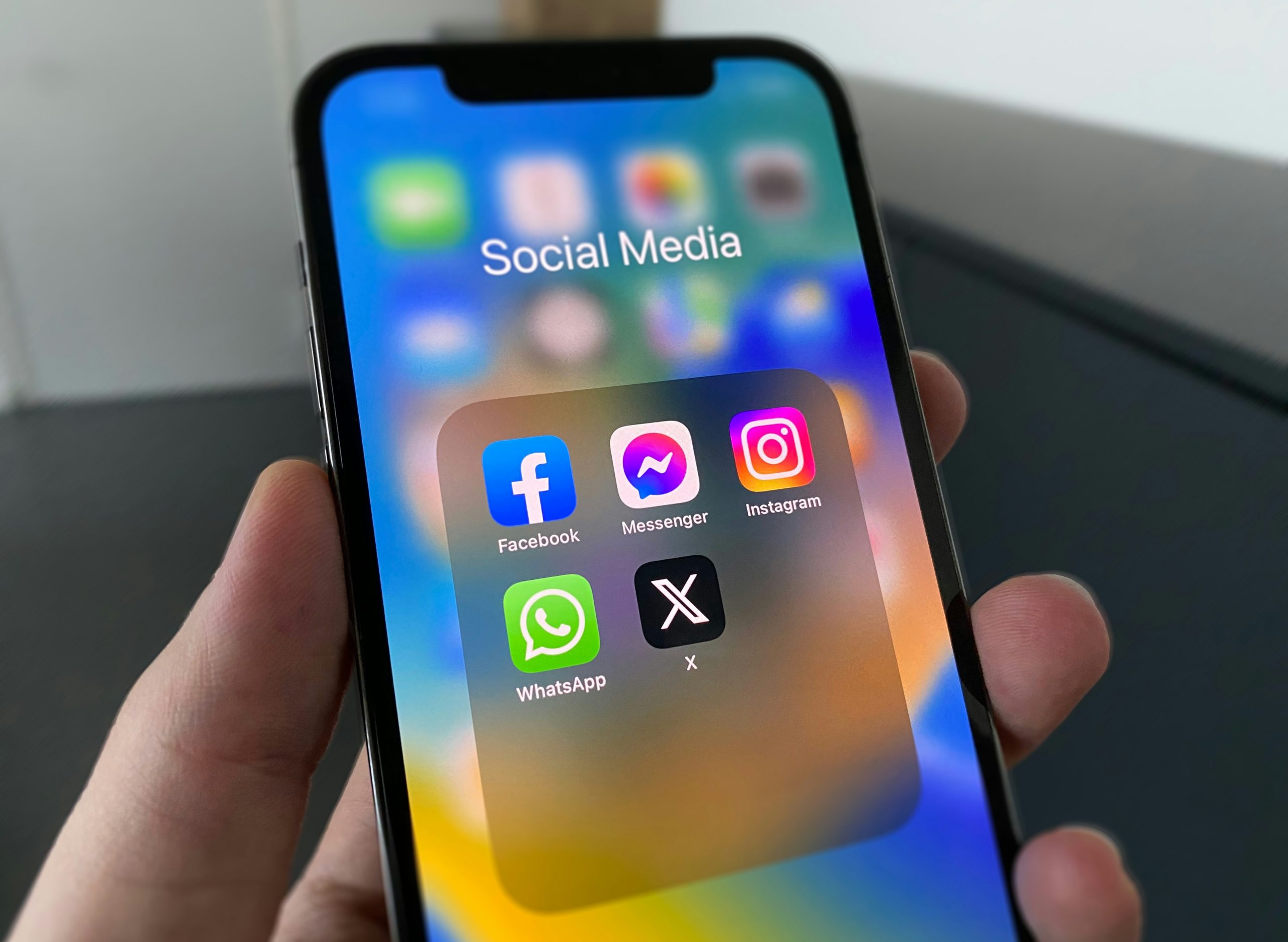 Photo of a smartphone screen showing the social media apps for Facebook, Messenger, Instagram, WhatsApp and X.