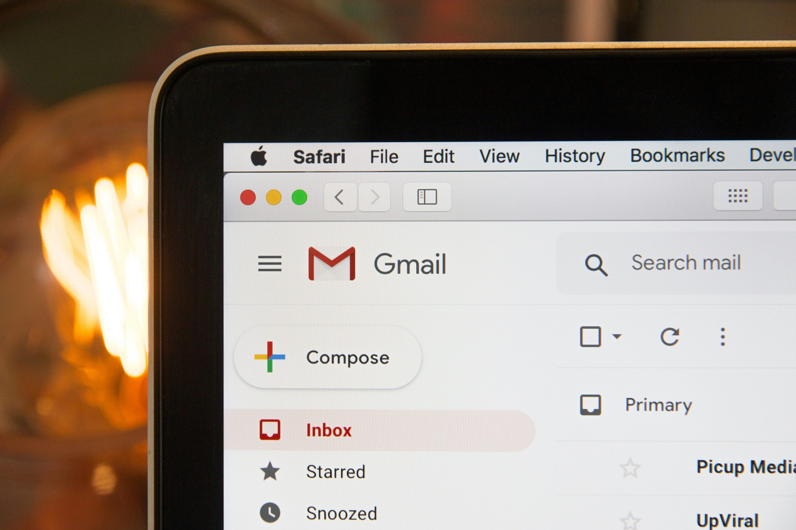 Photo of a laptop screen showing a browser with a Gmail inbox open.