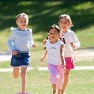 Three children running.