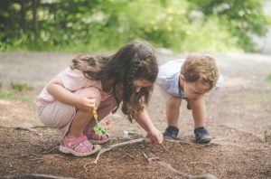 Two children playing outside.