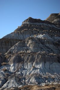 A hill in the badlands showing geological stratification