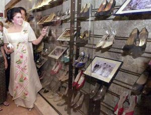 Photo of Imelda Marcos with her shoe collection