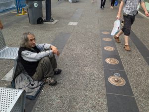 Photo of a panhandler on a city street