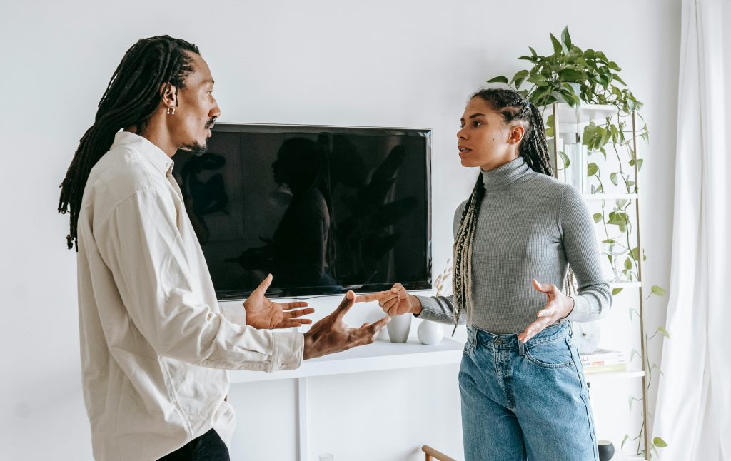 A couple arguing in their home