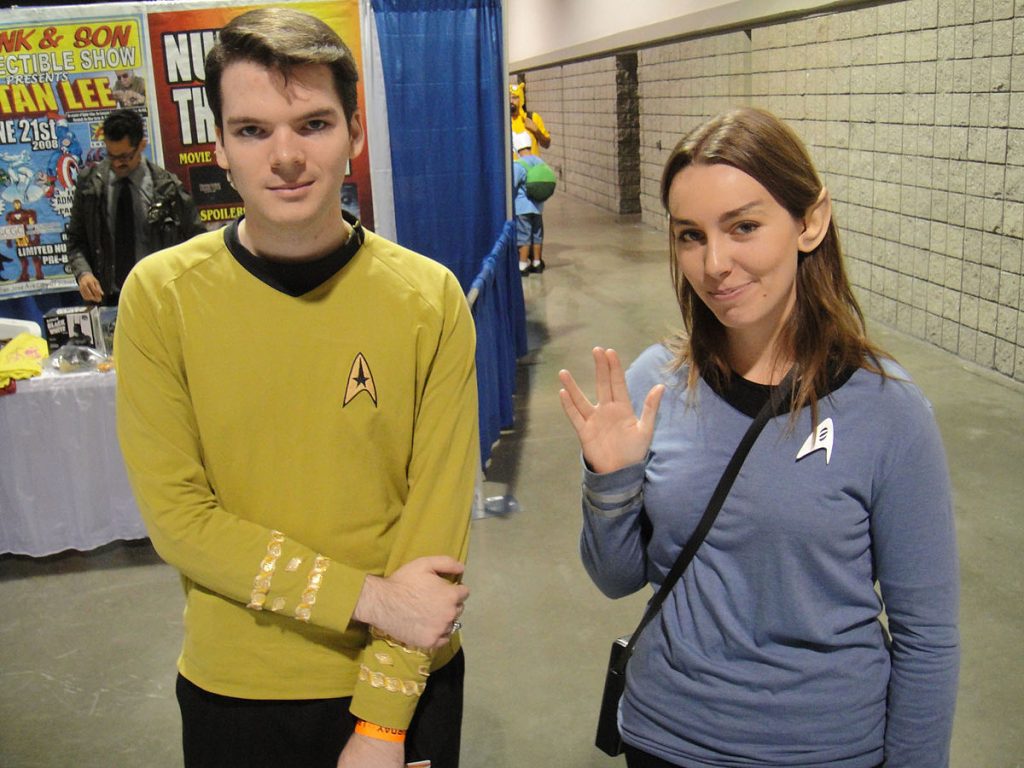 Two people in Star Trek costumes at a convention.
