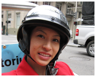 A woman wearing a helmet.