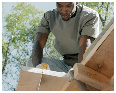 A man sawing wood.