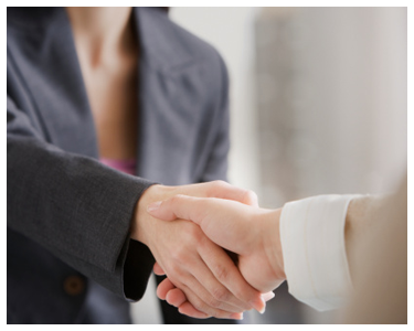 Two people shaking hands.