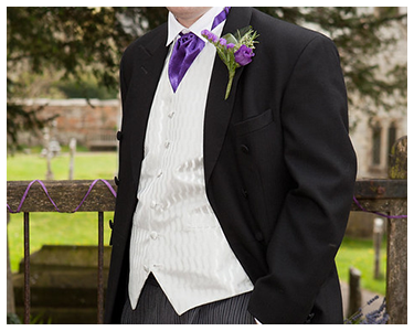 A three-piece formal men's suit.