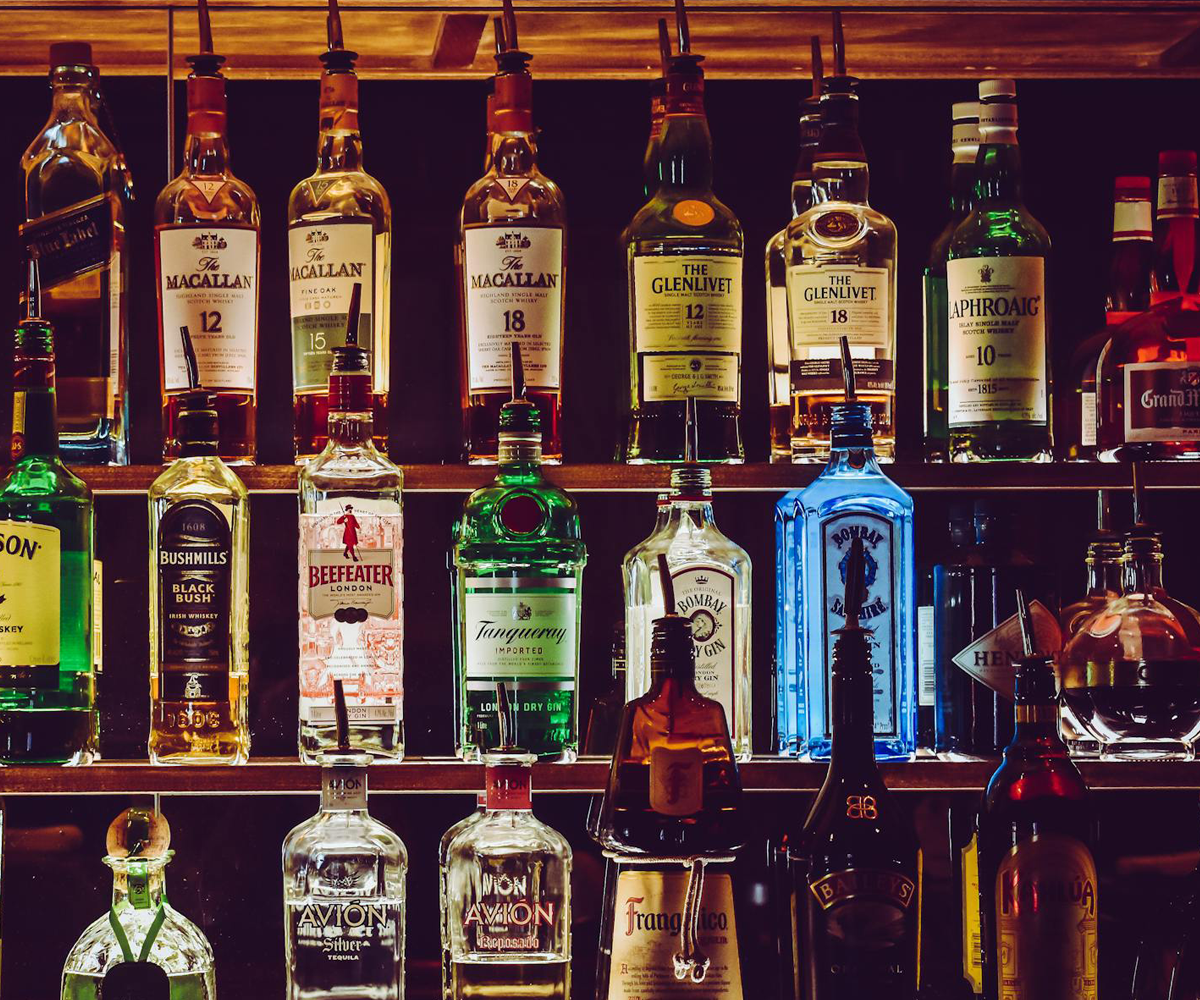 Shelves displaying bottles of alcohol.