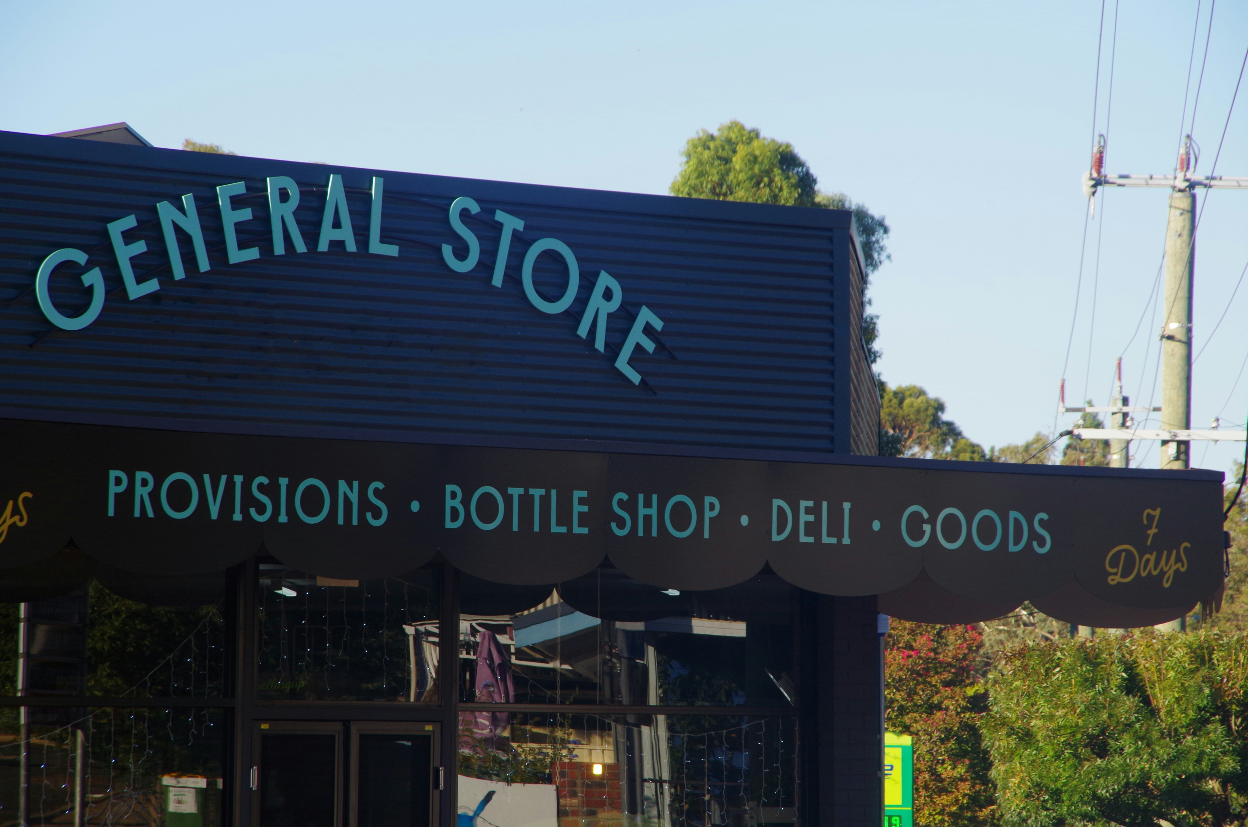 The exterior of a small general store.