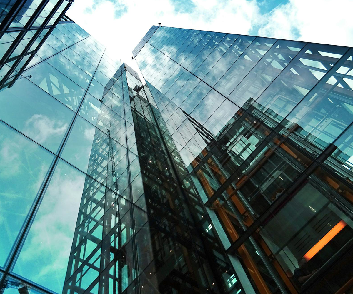 A high rise building with glass windows.