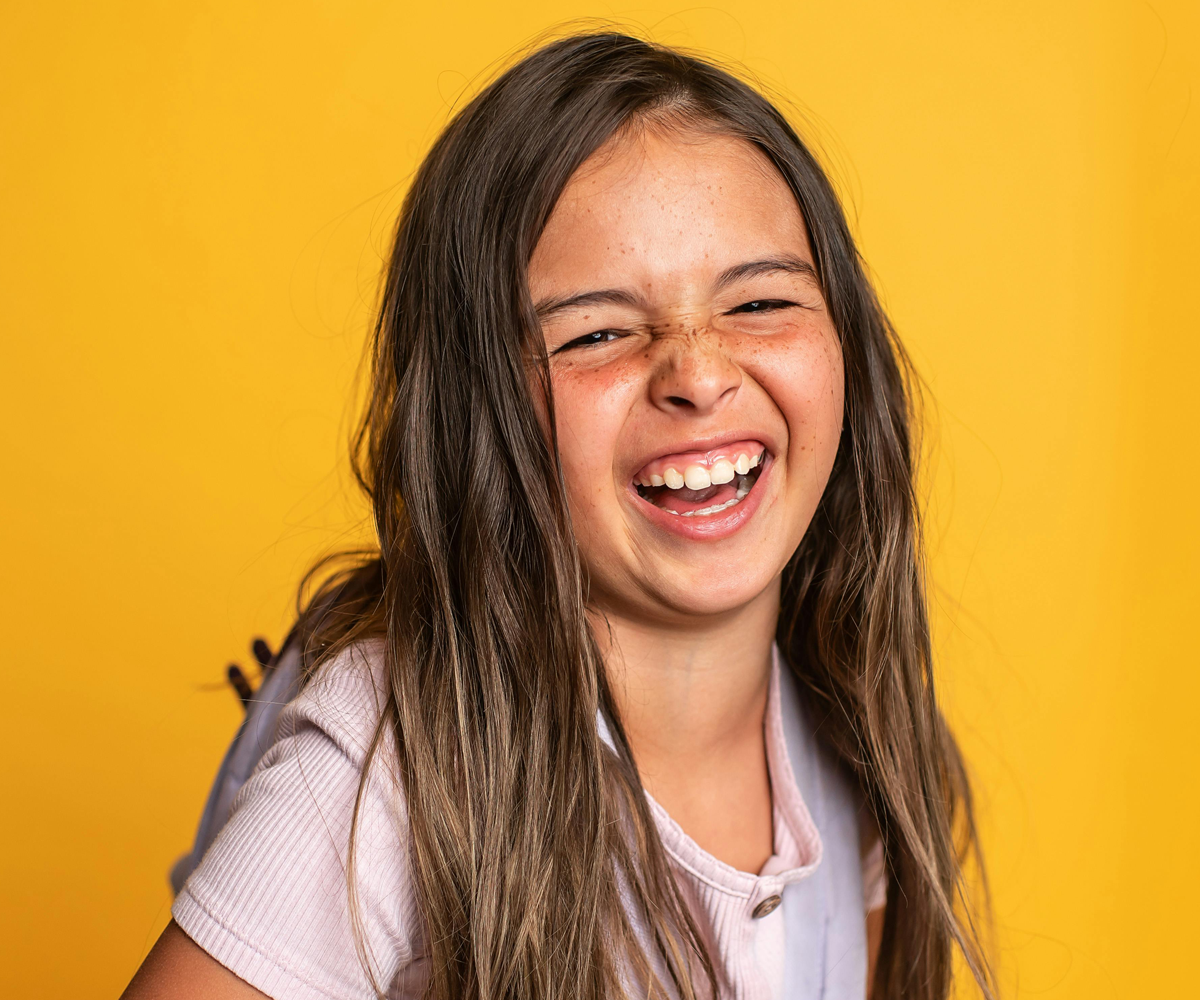 A young girl laughing.