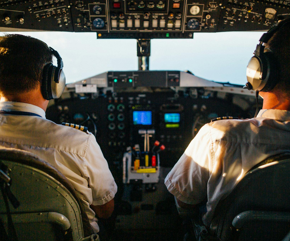 Two pilots in an airplane cockpit.