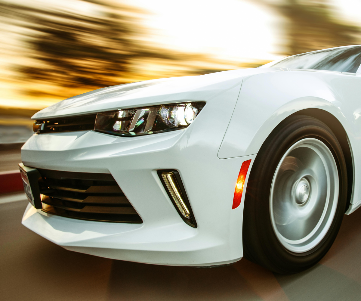 A sports car driving fast.