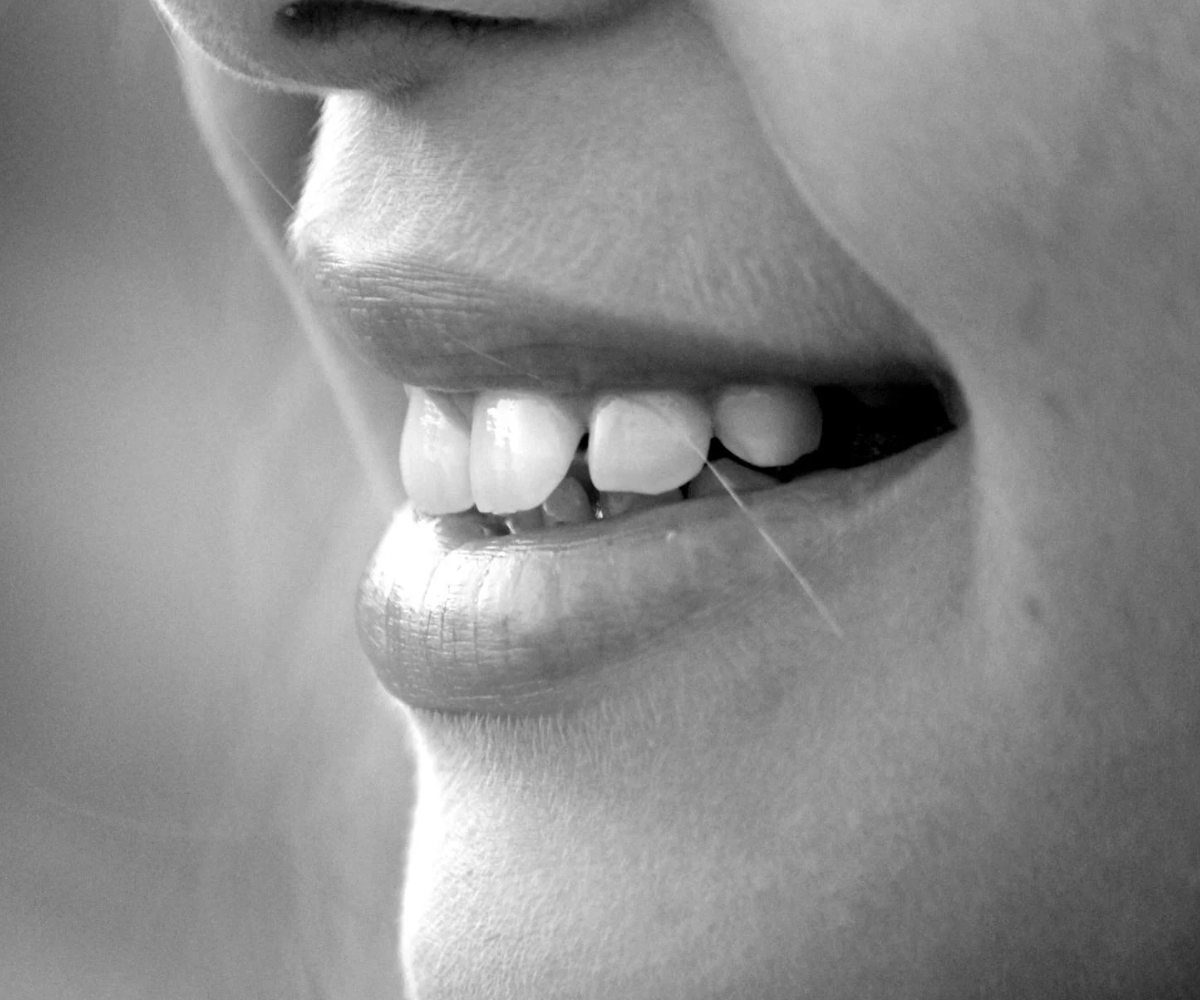 A close-up of a woman smiling.