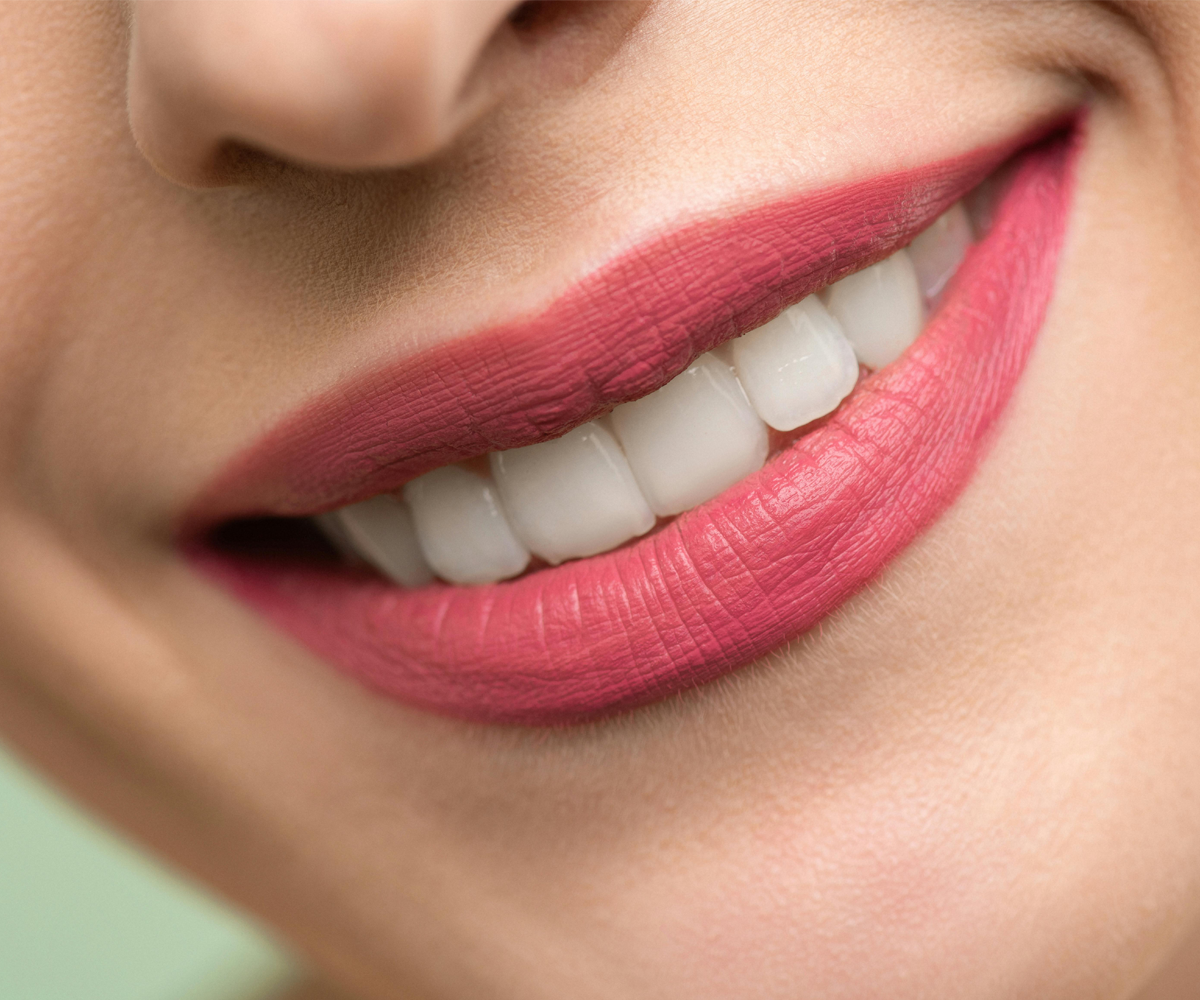 A close up of a woman smiling.