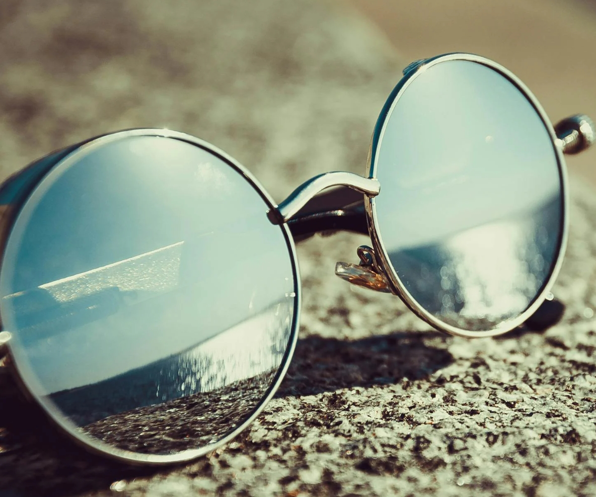 A pair of silver sunglasses.