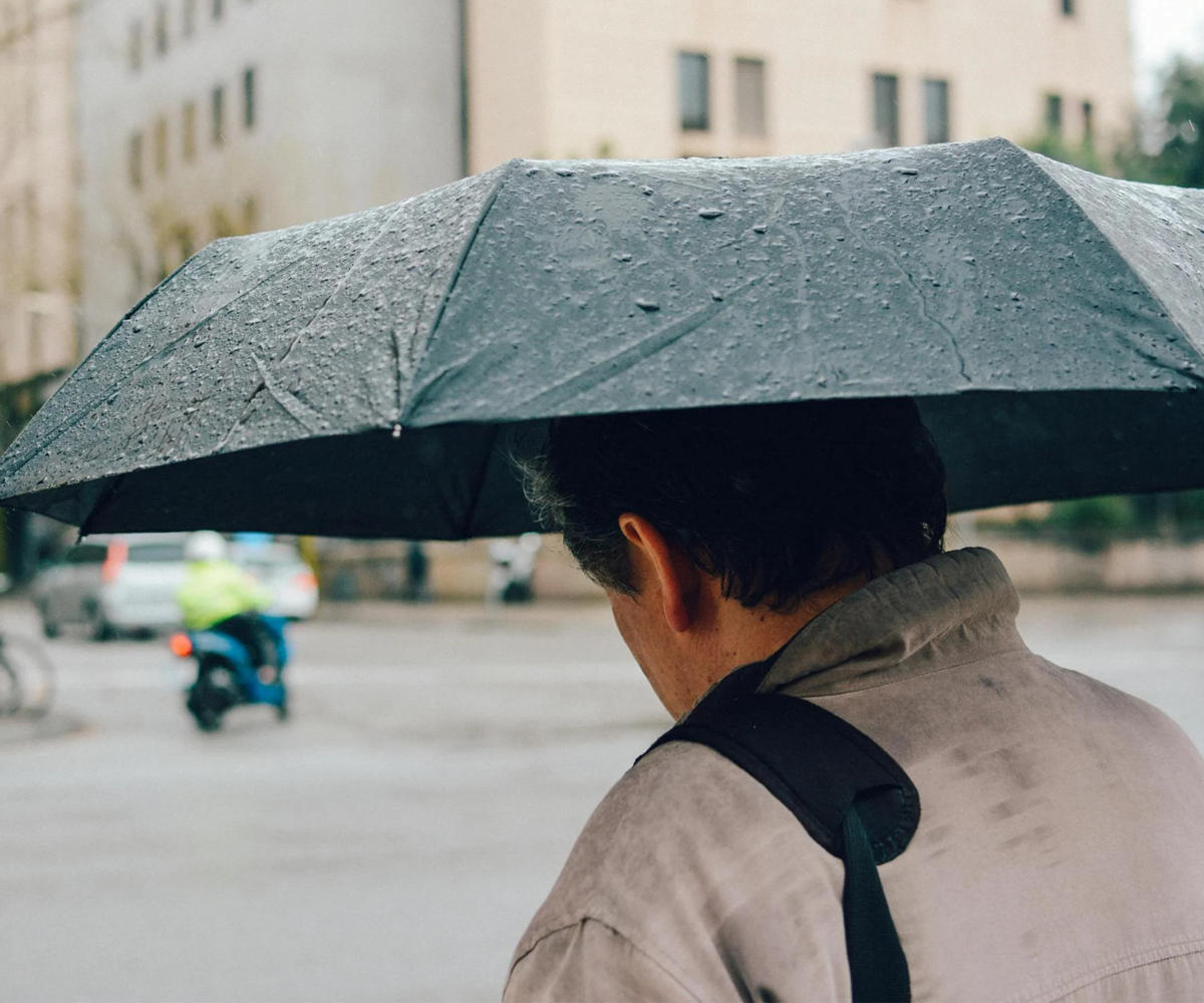 A man holding an umbrella.