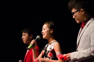 photo of a young woman delivering a presentation