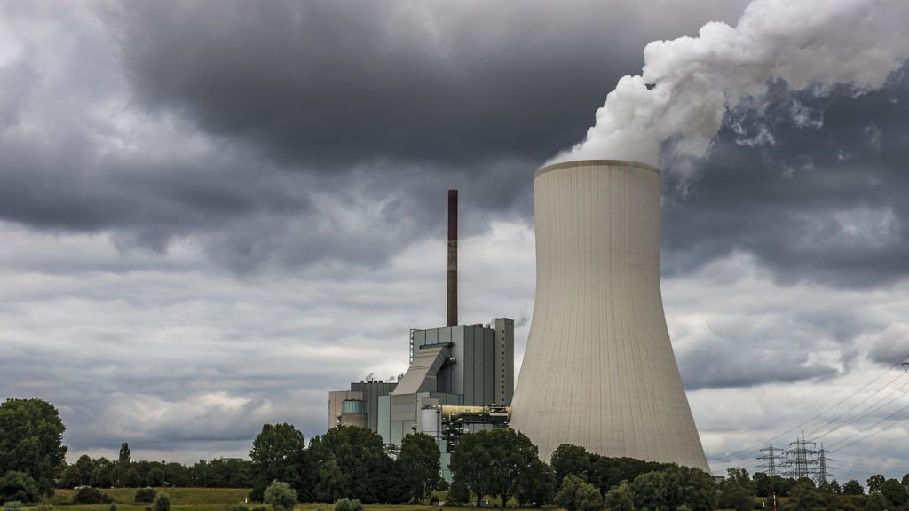 Power plant with smoke coming out of stack