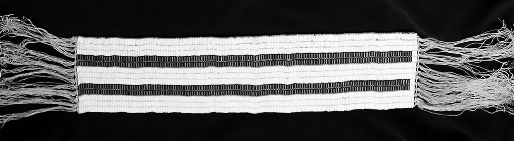 A double row Wampum belt displayed horizontally