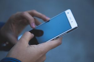 A person looking at their smartphone.