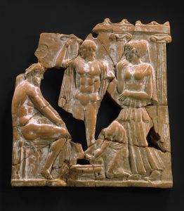 Bronze colored terracotta plaque which depicts a scene from Odyssey.
