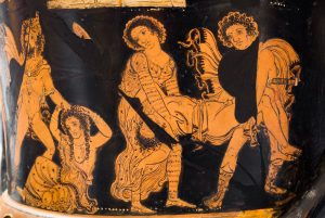 A painting on a ceramic vessel depicting a man and tattooed women carrying the corpse of a man.