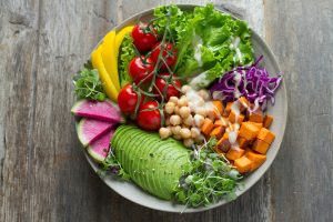 A bowl of fruits, veggies and legumes.