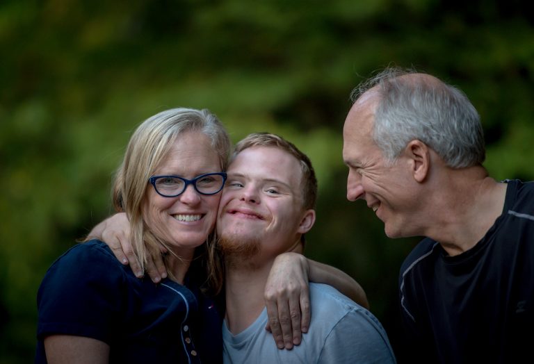 mother, father, child with down syndrome