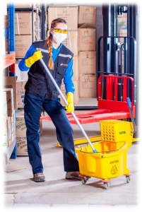 A custodial worker adorned in Personal Protective Equipment.
