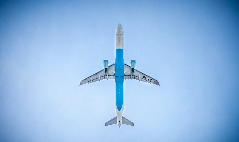 Airplane against a blue sky.