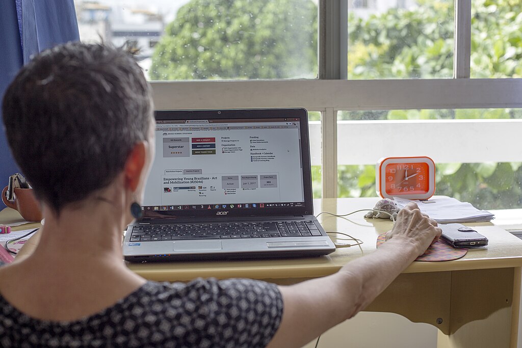 A non-profit worker looks up opportunities for funding on her computer in Salvador, Brazil. May 29, 2017