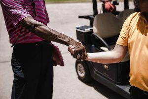 two men shaking each others hands