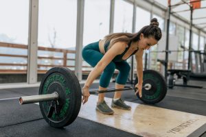 Woman lifting a barbell.