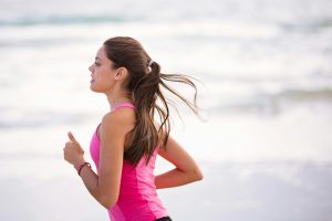 A woman jogging outside.