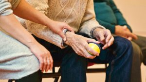 A person holding a stress ball.