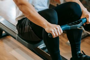 person using a rowing machine