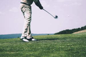 A person golfing
